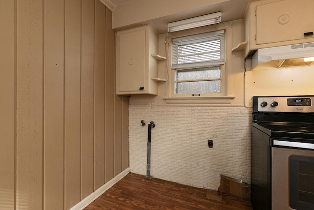 kitchen with white cabinets, dark wood-type flooring, and electric range