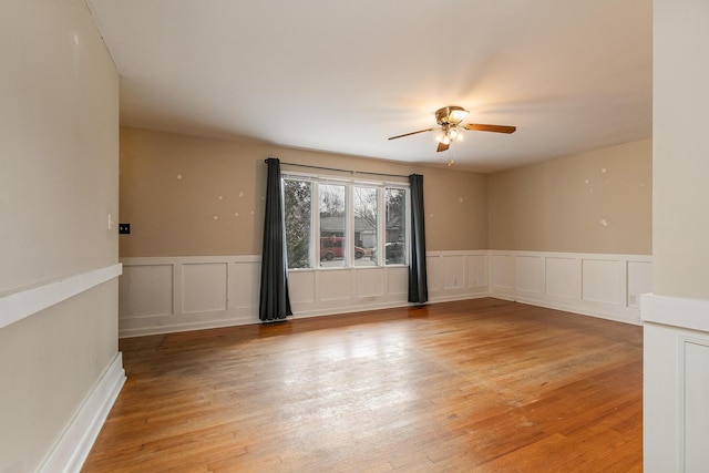 empty room featuring ceiling fan and light wood-type flooring