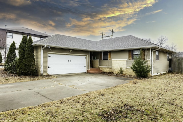 ranch-style home featuring a garage