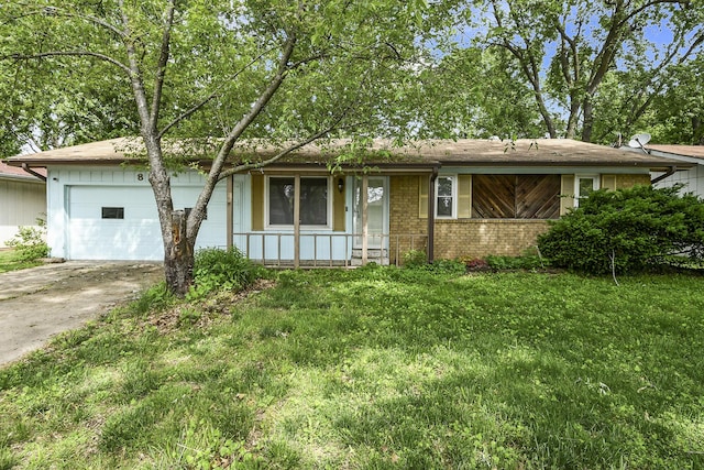 853 E Guinevere St, Springfield, MO 65807 - ranch-style home featuring a garage, concrete driveway, brick siding, and a front yard
