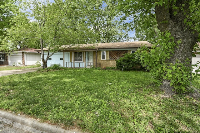 853 E Guinevere St, Springfield, MO 65807 - ranch-style home with brick siding, an attached garage, a front lawn, and driveway