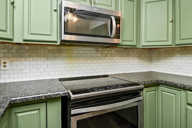 853 E Guinevere St, Springfield, MO 65807 - kitchen featuring appliances with stainless steel finishes, green cabinets, and decorative backsplash