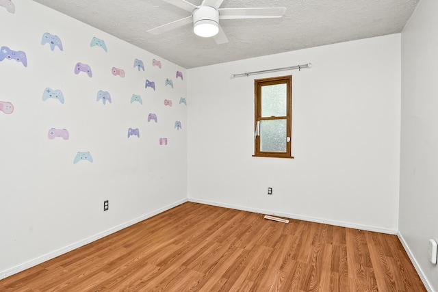 853 E Guinevere St, Springfield, MO 65807 - empty room featuring a textured ceiling, light wood finished floors, baseboards, and ceiling fan