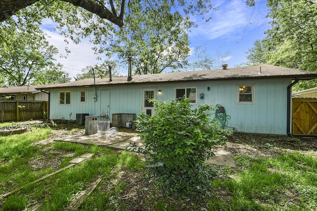 853 E Guinevere St, Springfield, MO 65807 - back of property featuring fence and cooling unit