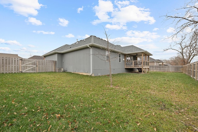 rear view of property with a yard