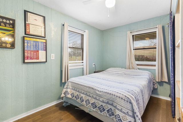 bedroom featuring dark hardwood / wood-style floors and ceiling fan