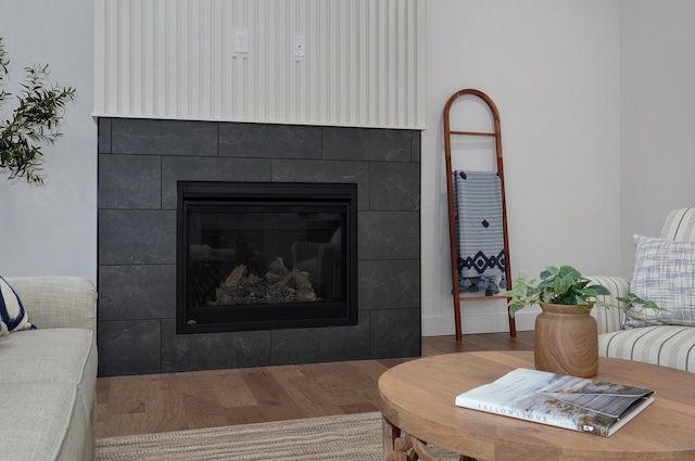 interior space featuring dark hardwood / wood-style floors and a tile fireplace