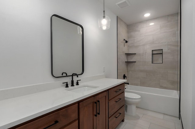 full bathroom with tiled shower / bath combo, vanity, and toilet