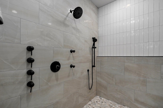 bathroom with a tile shower