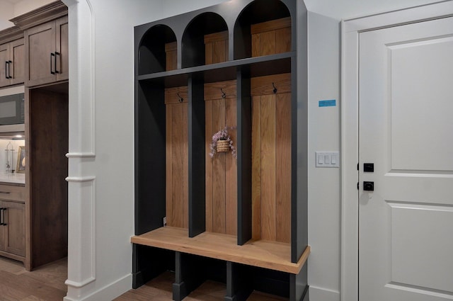 mudroom with light hardwood / wood-style flooring