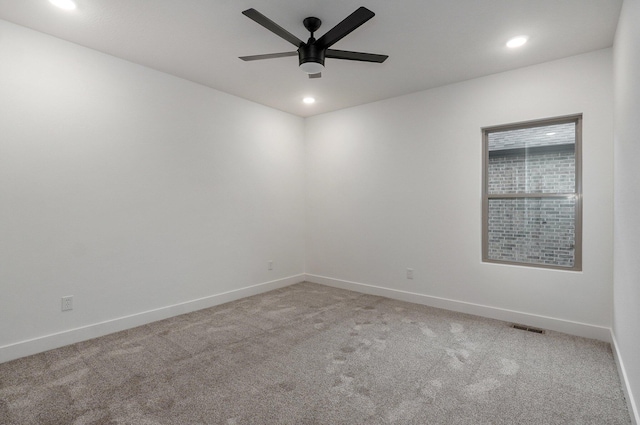 empty room with carpet and ceiling fan