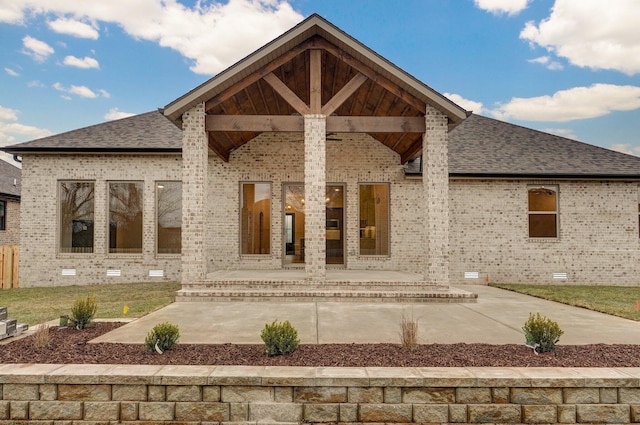 rear view of house featuring a patio