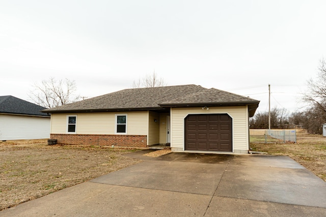 ranch-style home featuring a garage