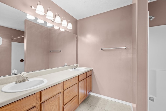 bathroom with tile patterned flooring and vanity