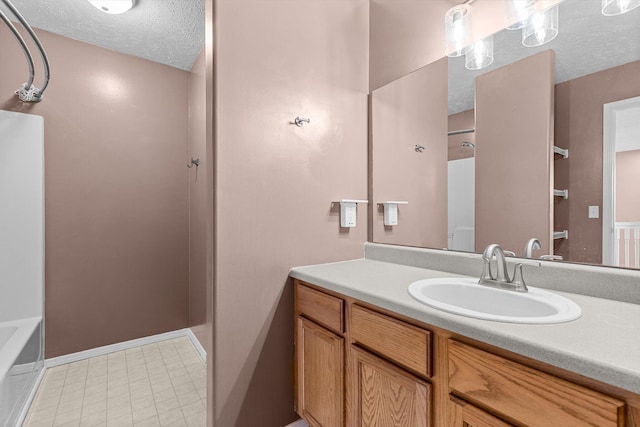 bathroom featuring vanity and a textured ceiling