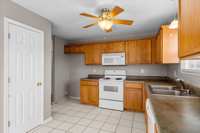 kitchen with decorative light fixtures, sink, light tile patterned floors, ceiling fan, and white appliances