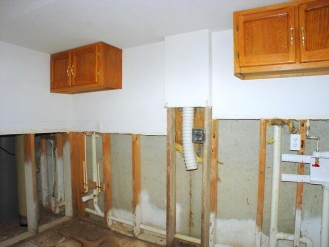 interior space with brown cabinetry and light countertops