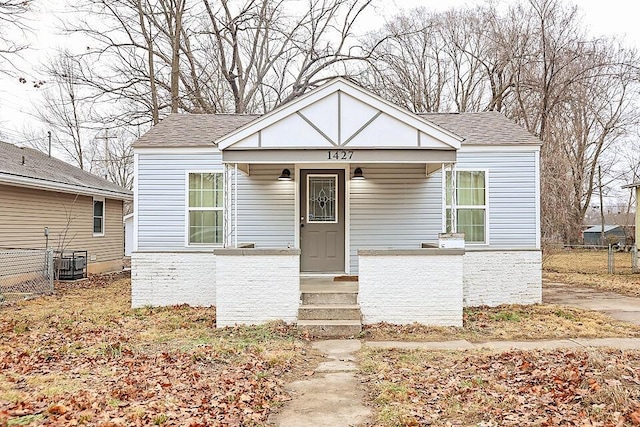 bungalow featuring central AC and covered porch