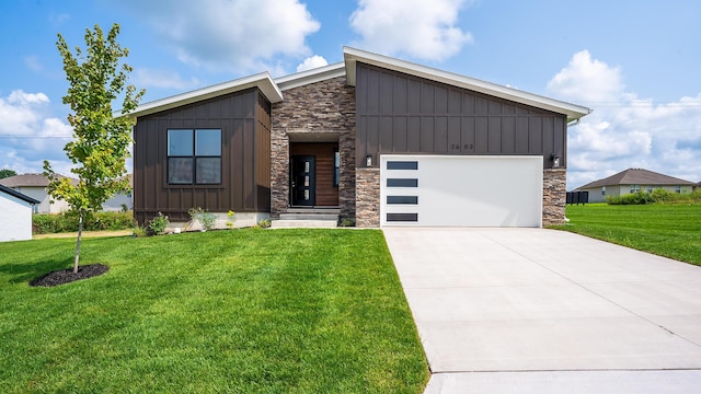 contemporary home with a garage and a front yard