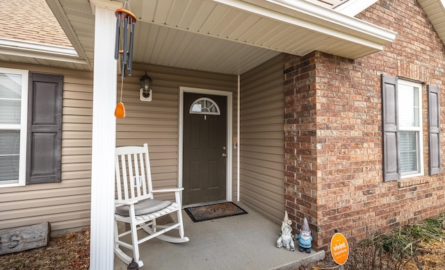 doorway to property featuring a porch