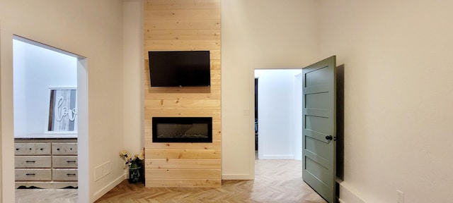 living room with a high ceiling and parquet floors