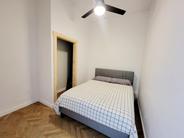 bedroom featuring parquet floors and ceiling fan