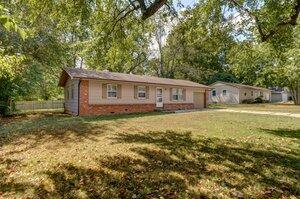 ranch-style home with a front lawn