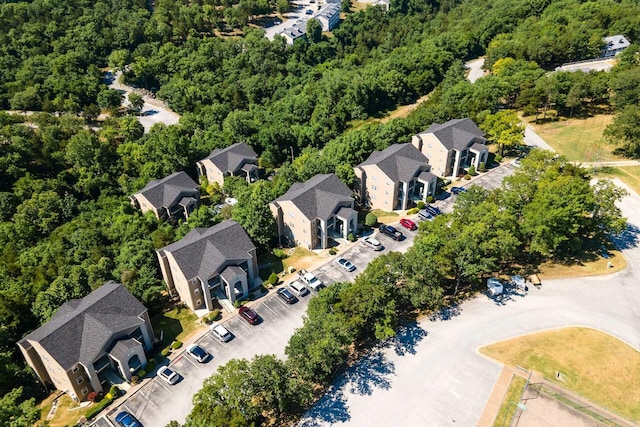 aerial view with a residential view and a wooded view