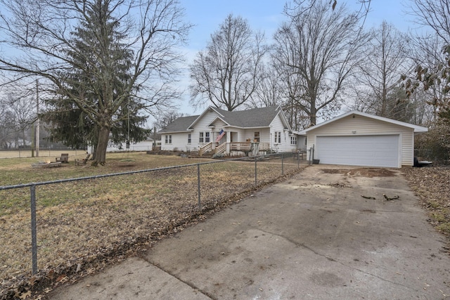 view of front of home with a garage and an outbuilding