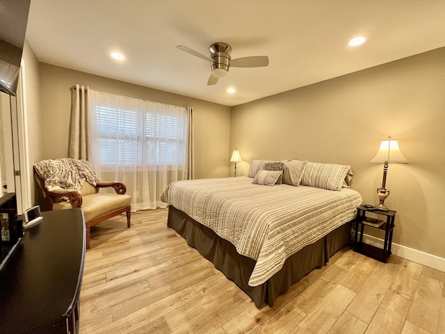 bedroom featuring ceiling fan and light hardwood / wood-style flooring