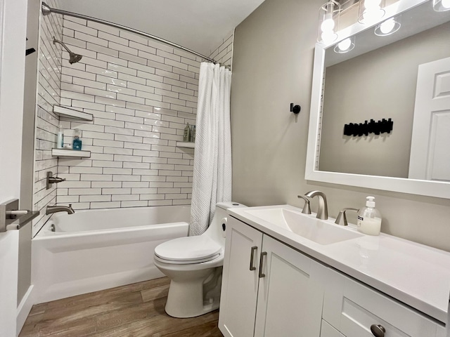 full bathroom featuring hardwood / wood-style flooring, vanity, shower / tub combo with curtain, and toilet