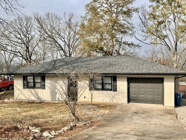 ranch-style house featuring a garage