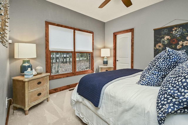 bedroom featuring ceiling fan and carpet