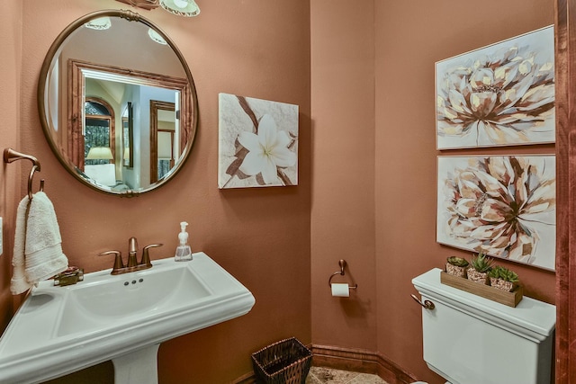 bathroom with toilet and sink