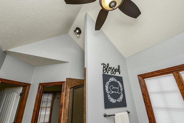 room details with ceiling fan and a textured ceiling