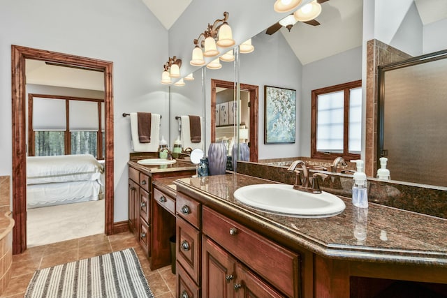 bathroom featuring ceiling fan, lofted ceiling, an enclosed shower, and vanity