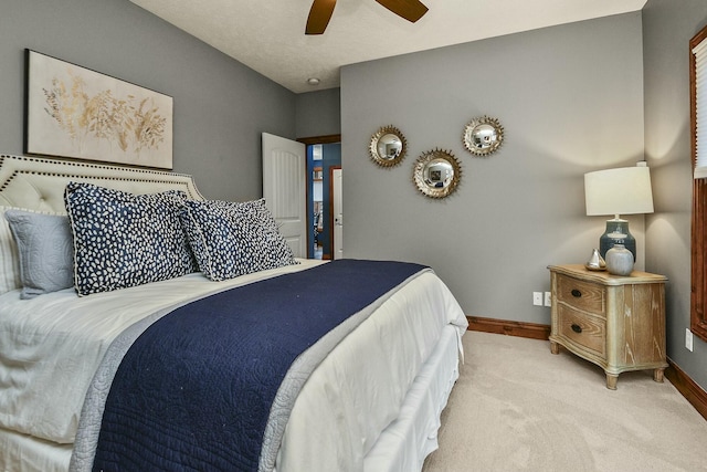 bedroom featuring ceiling fan and light colored carpet