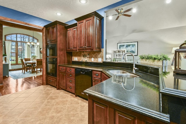 kitchen with ceiling fan with notable chandelier, dishwasher, sink, decorative backsplash, and a textured ceiling