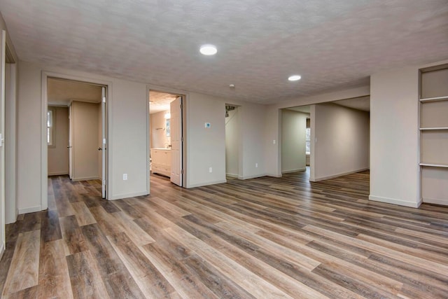 interior space with hardwood / wood-style floors and a textured ceiling