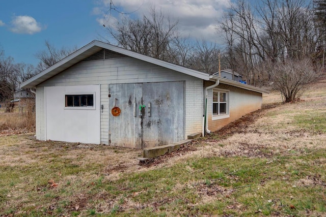 view of outdoor structure with a yard