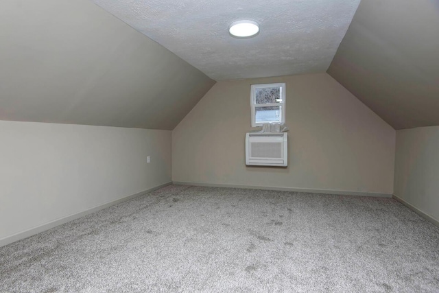 bonus room with lofted ceiling, carpet floors, cooling unit, and a textured ceiling