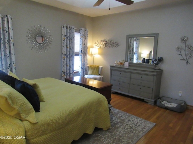 bedroom featuring dark hardwood / wood-style flooring and ceiling fan