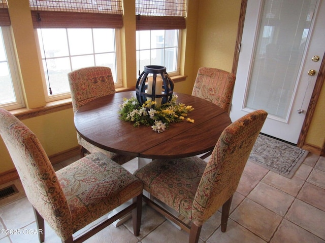 dining room with light tile patterned floors