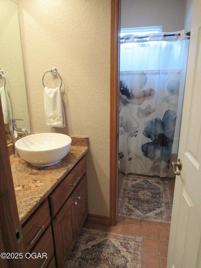 bathroom with vanity and tile patterned flooring