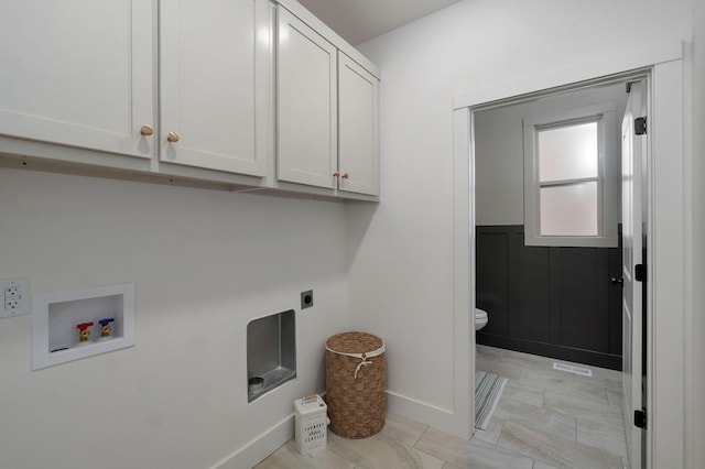 laundry area with cabinets, hookup for a washing machine, and electric dryer hookup