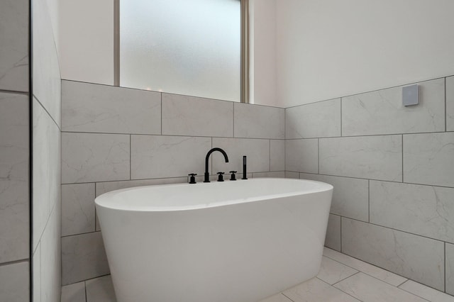 bathroom with a washtub