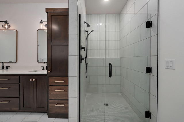 bathroom with vanity, tile patterned floors, and a shower with shower door