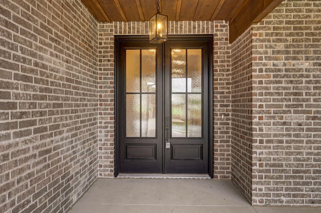 view of exterior entry featuring french doors