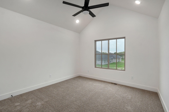 spare room with ceiling fan, carpet floors, and high vaulted ceiling