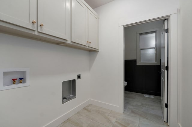 laundry area with hookup for a washing machine, cabinets, and hookup for an electric dryer